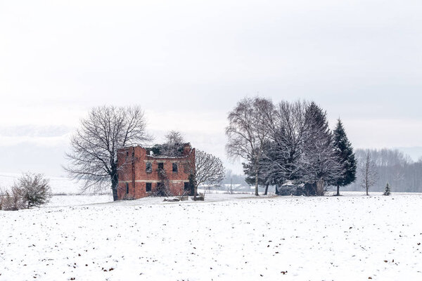 snow covering an abandoned farm