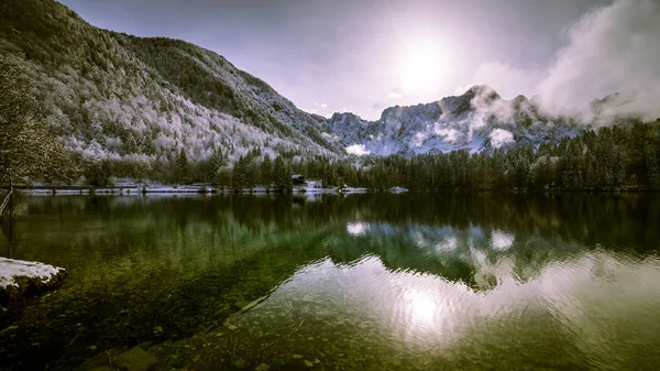 First snow at the mountain lake — Stock Photo, Image