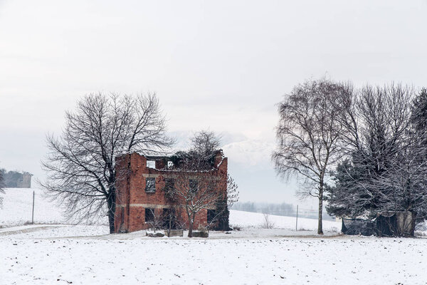 snow covering an abandoned farm