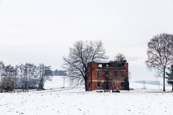 snow covering an abandoned farm