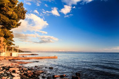Denizde, Trieste günbatımı