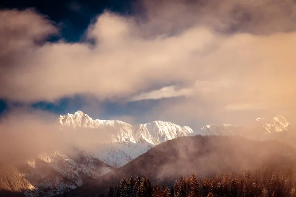 Mangart capped by the fog in a winter day — Stock Photo, Image