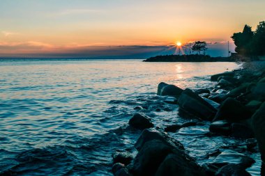 Denizde, Trieste günbatımı