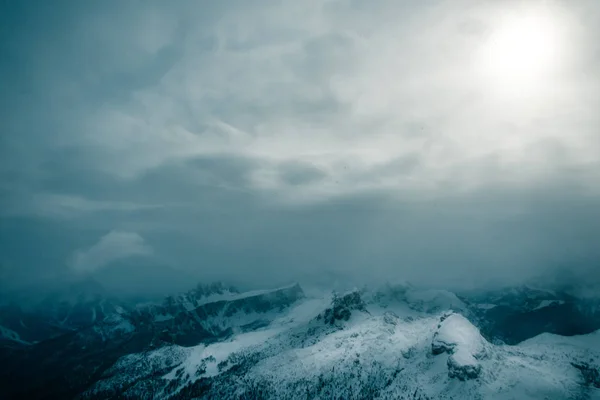 Stormy clouds in italian dolomites in a snowy winter — Stock Photo, Image