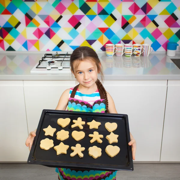 Little girl preparing a cookie on kitchen. — Stock Photo, Image