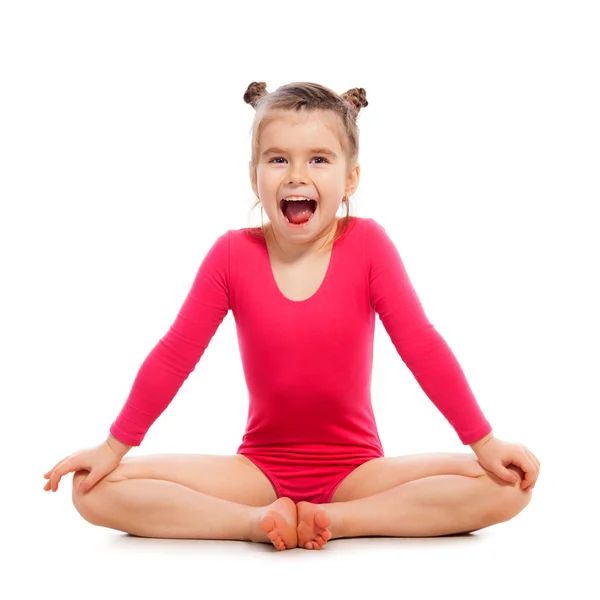 Cute little girl gymnast on a white background — Stock Photo, Image