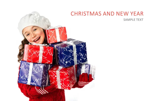 Happy little girl with Christmas gifts on isolated white background — Stock Photo, Image