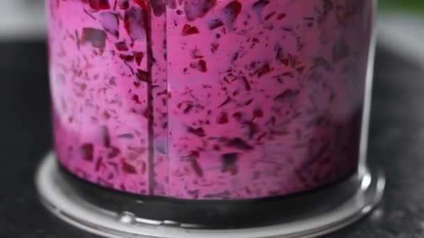 Beetroot are choped in a blender and mixed — Stock Video