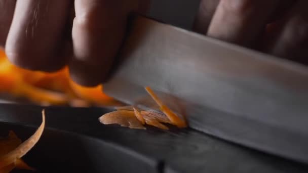 Chef shreds carrot for vegetable salad vegetarian — Stock Video