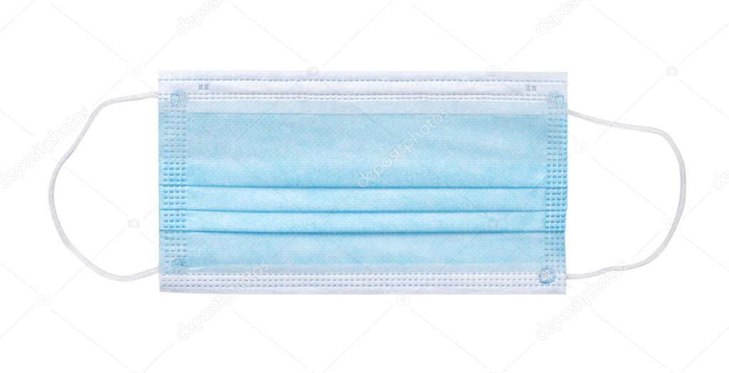 Blue medical face mask isolated on white. Flat lay. Clipping path included.