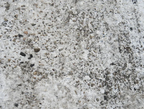 Textura de asfalto con un poco de nieve en la superficie . — Foto de Stock