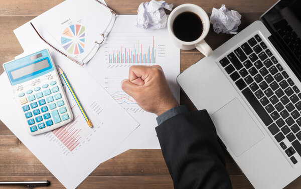 fist business man hand on office desk