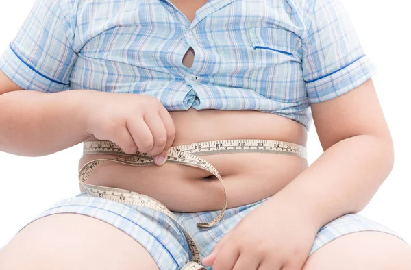 Fat boy measuring his belly with measurement tape isolated — Stock Photo, Image