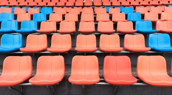 Orange and blue plastic spectator seats, competition concept — Stock Photo, Image