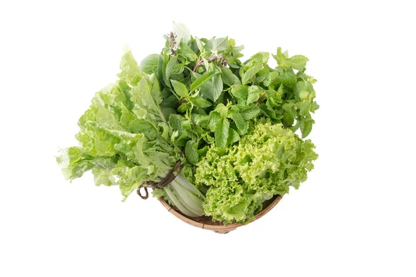 Peppermint, sweet basil, lettuce in bamboo basket isolated — Stock Photo, Image