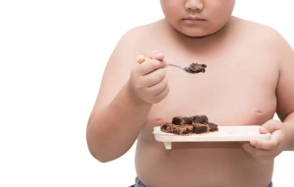obez şişman çocuk yemek nama çikolata üzerinde beyaz izole 