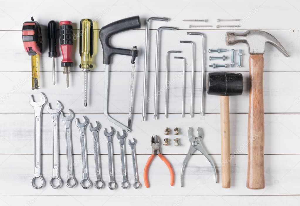 set of tools supplies on wood background 