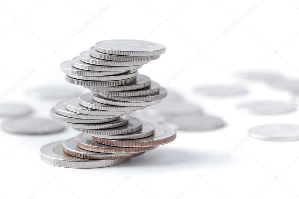 Coins stacked on each other in different positions. 
