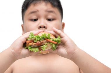 domuz eti hamburger izole obez şişman çocuk el arka plan üzerinde