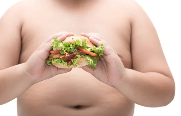 Свиной гамбургер в толстой руки толстяка изолированы . — стоковое фото