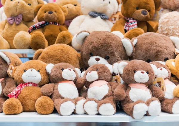 Cute teddy bears dall on shelves — Stock Photo, Image