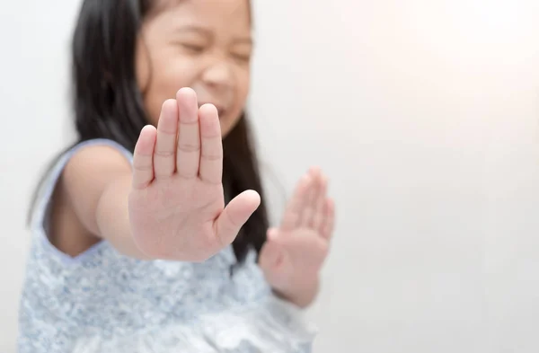 Asian girl making stop gesture with her hand — Stock Photo, Image