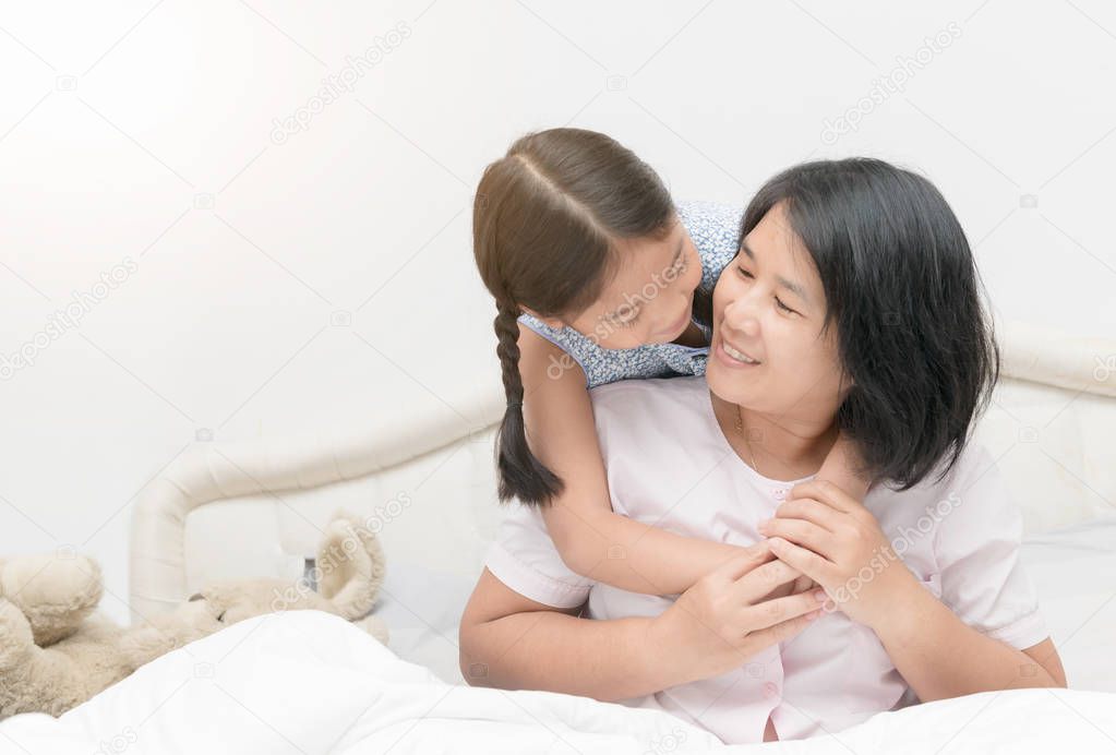 mother and daughter looking at each other and smiling