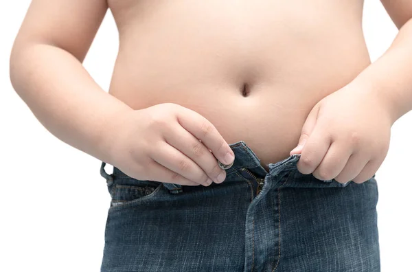 Obese fat boy try to wear jeans isolated — Stock Photo, Image