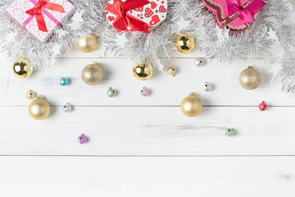 Gift box with colorful small bell and Christmas ball 