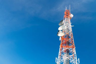 communication tower on blue sky background clipart
