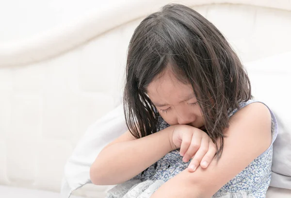 Little girl crying on bed, sad and angry — Stock Photo, Image