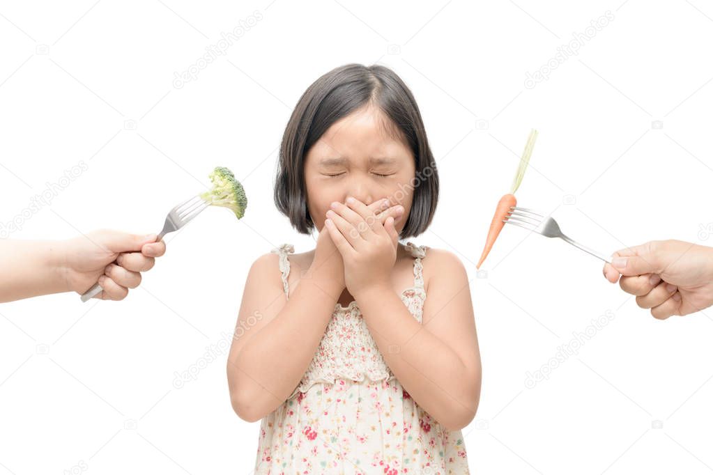asian child girl with expression of disgust against vegetables i