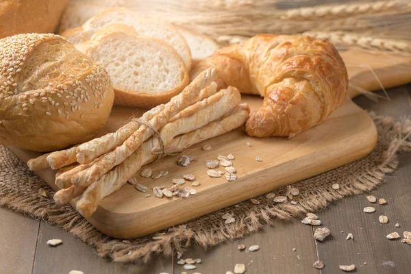 Homemade bread sticks, croissant and bread — Stock Photo, Image