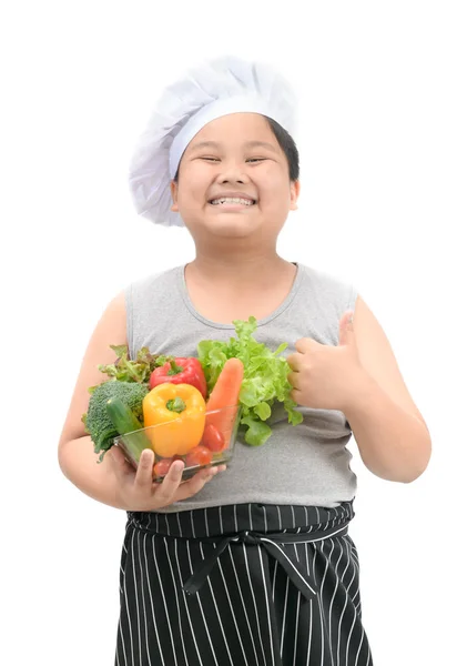 Menino obeso chef smaile e gosta de comer legumes — Fotografia de Stock