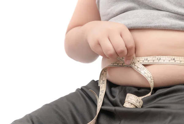 Fat child check out his body fat with measuring tape — Stock Photo, Image