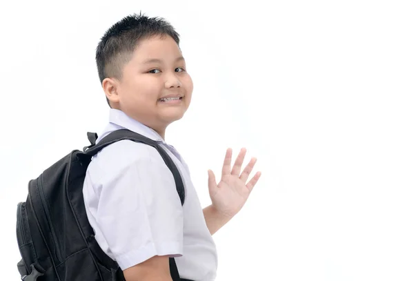 Gordo chico estudiante yendo a la escuela y saludando adiós — Foto de Stock