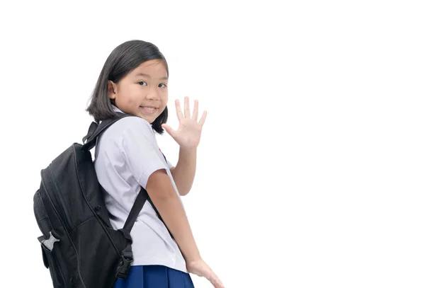 Menina estudante indo para a escola e acenando adeus — Fotografia de Stock