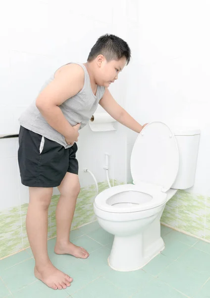 Boy suffer stomach and vomit in toilet, diarrhea — Stock Image Boy suffer stomach and vomit in toilet, diarrhea Stock Picture