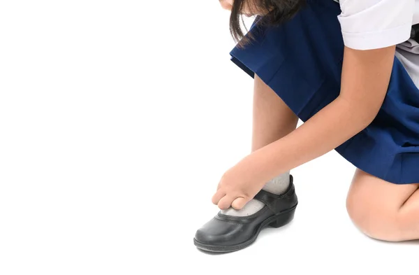 Asian kid girl lacing student shoes isolated — Stock Photo, Image