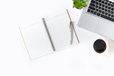 White office desk table Blank notebook with laptop 