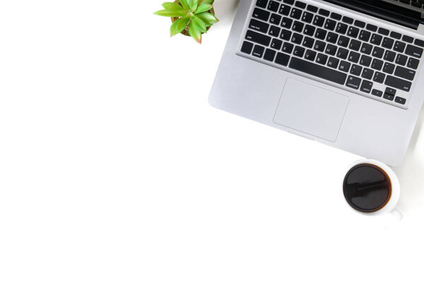 White office desk table with laptop computer, cup of coffee. 