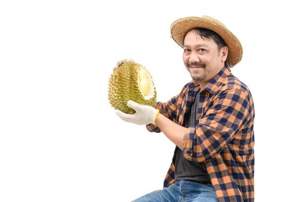 Happy farmer is carrying durian and smiling isolated on white background. Because it can be sold at a very good price in the market, King of fruits and summer fruits in Thailand