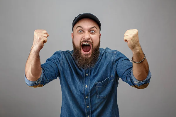 Emotional brutal man with a beard — Stock Photo, Image