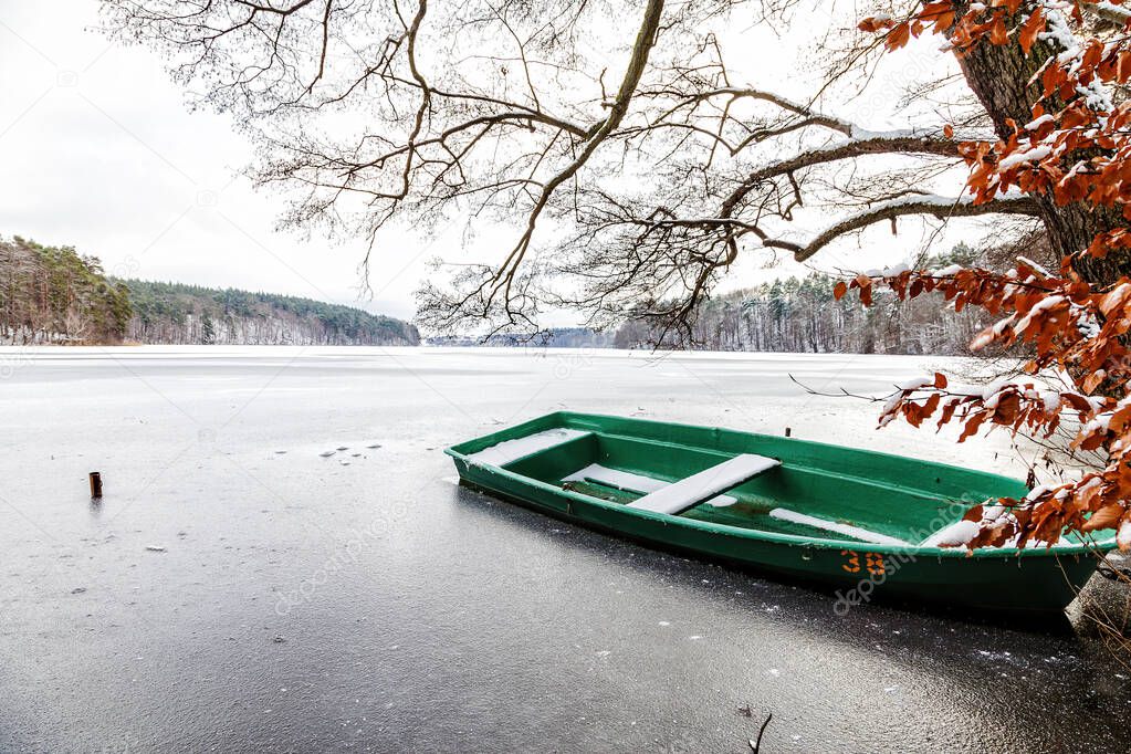 A rowing boat in a frozen lake