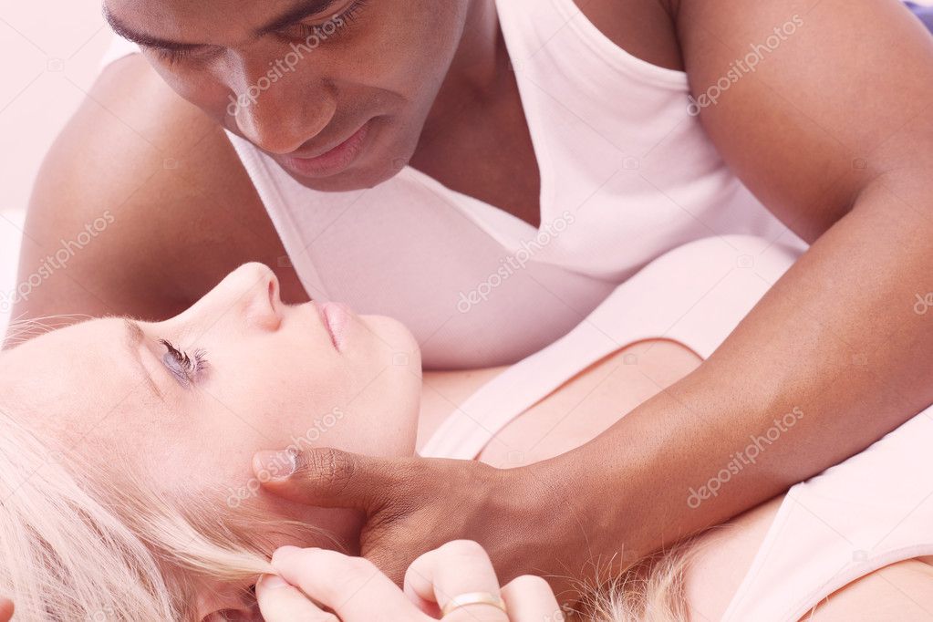 Interracial young couple making love