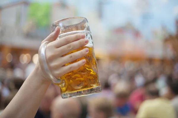 Raising beer steins at Oktoberfest