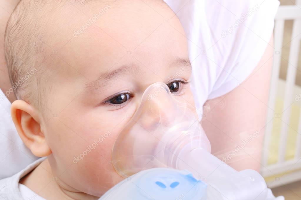 Baby boy at the hospital gets inhaler treatment for cough