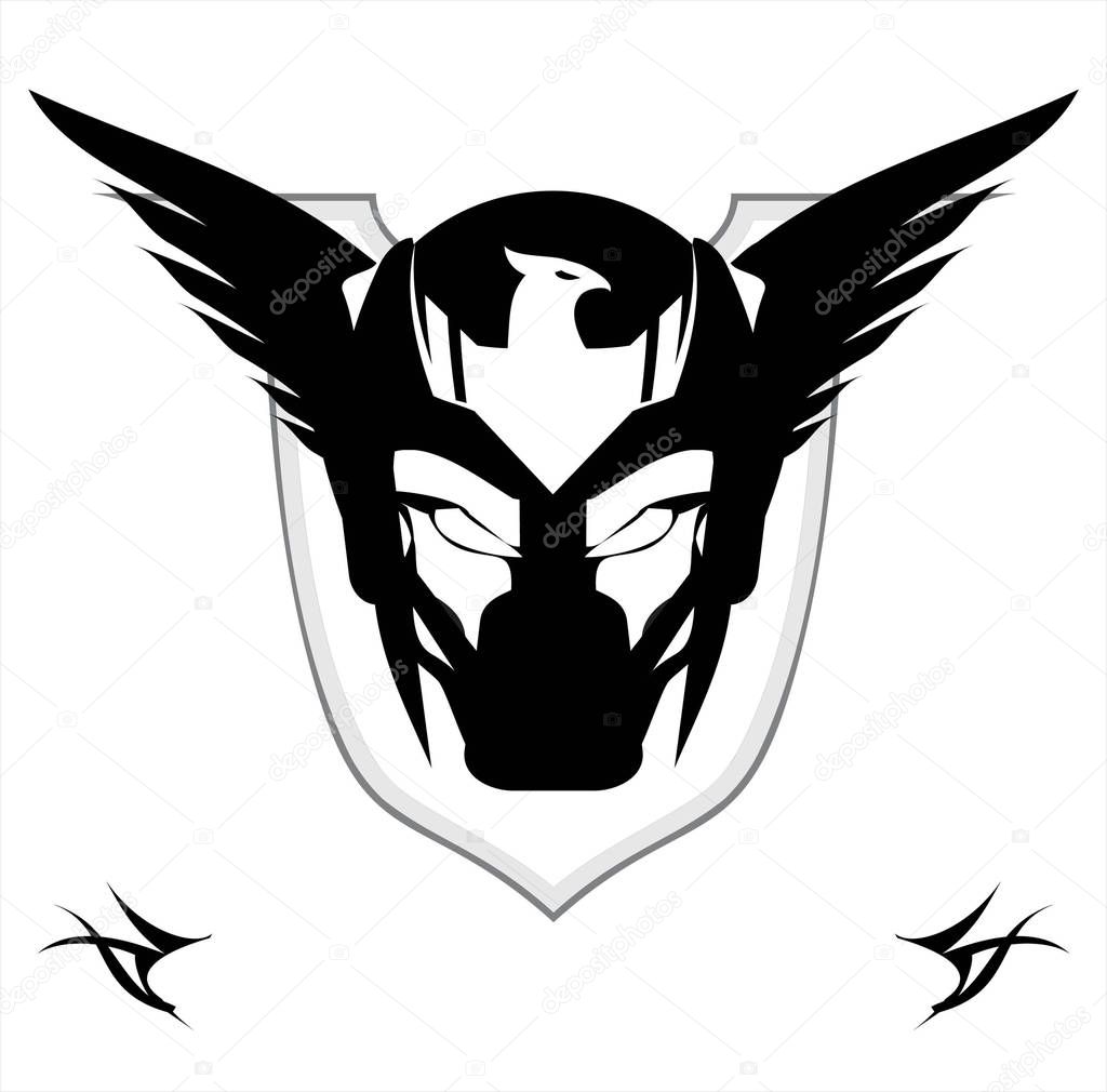 Superhero Head. Winged Black Mask over the shield. Biker. Superhero. Villain. Artwork. Warrior Mascot. Warrior head. Suitable for team identity, game icon, emblem, mascot, apparel, biker community,etc
