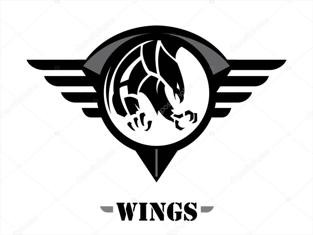 Attacking black hawk on the black winged circle shield. wings of team.