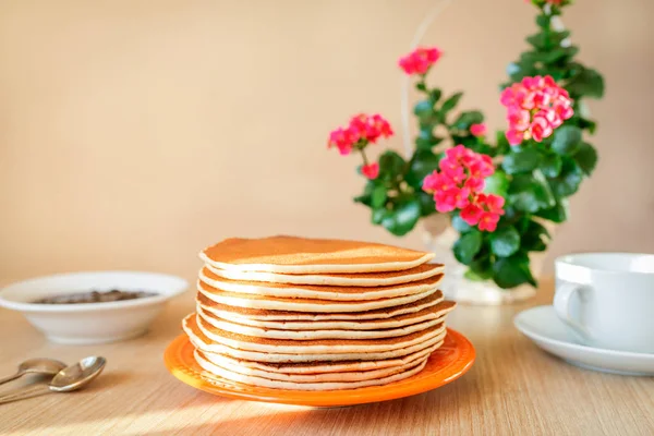 Real food. Pancakes on the table with home flower. Authentic breakfast